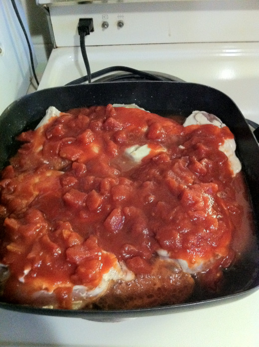 Add canned diced tomatoes.