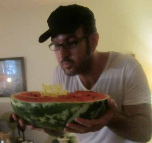 My brother's July birthday with candle in a watermelon
