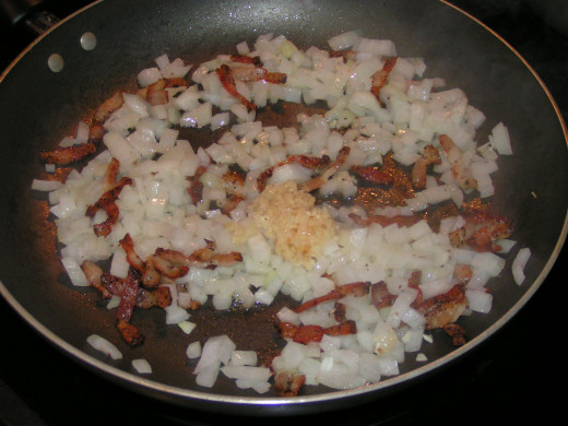 Step 3 - Sauté onions and garlic in bacon fat.