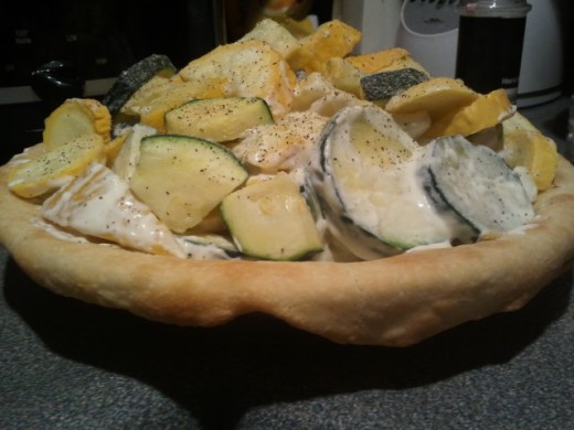 Be sure to fill in pie crust. Piles up high but lowers as squash and zucchinis soften.