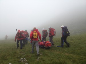 The Wasdale Mountain Rescue Team brings an injured climber down Scafell Pike