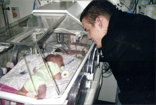 My son in NICU with his daughter, my granddaughter.