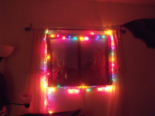 My window at night in my happy bedroom with the window in full view.  You can use white lights or none at all.