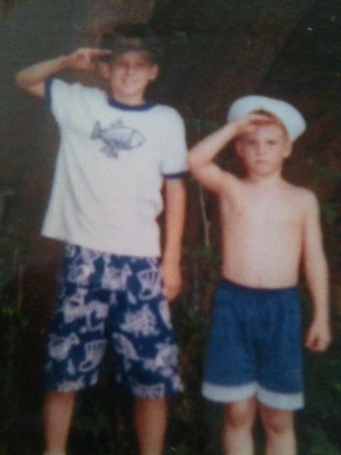 Brian (age 12) and Andy (age 6) practicing their salutes.