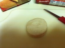 Take the biscuits out of the can and lay flat on a cutting board.