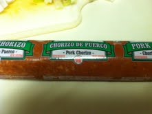 Chorizo sausage.  Comes wrapped in plastic and you remove the plastic to cook like ground beef.