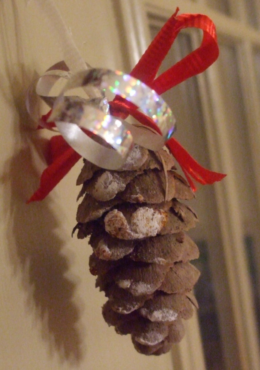 A pine cone and craft supplies you have at home create a lovely decoration.