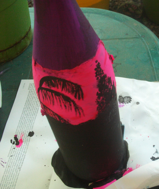 On this side of the bottle I painted a silhouette of both a palm tree and a pine tree.