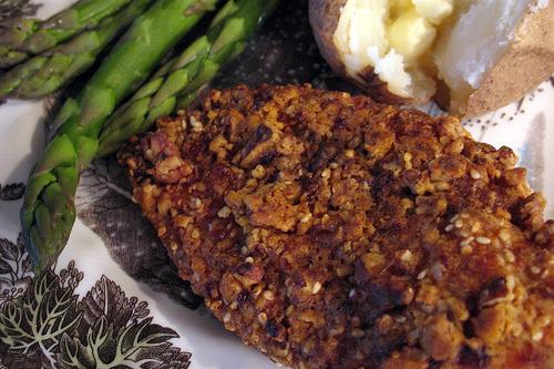 Pecan chicken is a quick and easy meal. Serve a fluffy baked potato and steamed asparagus with it for a delightful and delicious meal. 