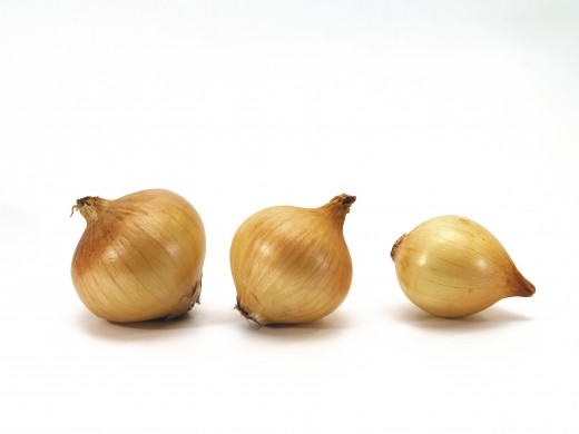 Onions may be chopped in cubes or sliced in crescent shapes then fried in oil in a skillet to let the onions soften to transparency.  