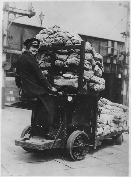 Woman driving motor mail truck 1920.