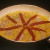 Lay the red peppers in place for decoration about halfway through the 20-minute cooking time. Lay the red peppers in place for decoration about halfway through the 20-minute cooking time.