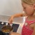With parental supervision, children can comfortably get to know the proper way to use a stove.  Grace very carefully stirs the butter and sugar until melted.