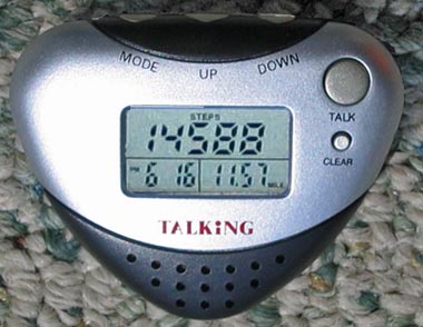 A heart-shaped digital pedometer with various information:  Steps, date, and calories are clearly indicated.