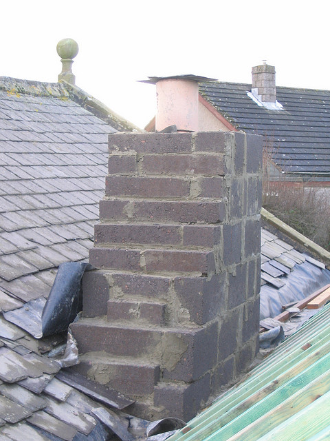 Where will rainwater travel when it strikes this roof? How will the rain affect the roof next door? 