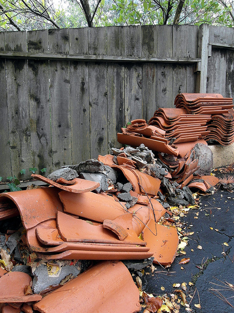 Broken roof or drainage tiles can signal water trouble. Roofs, foundations, or sewers should be checked closely if they have any broken tiles on or near them.
