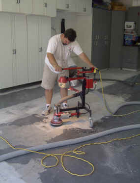 grinding the concrete surface in preparation for epoxy