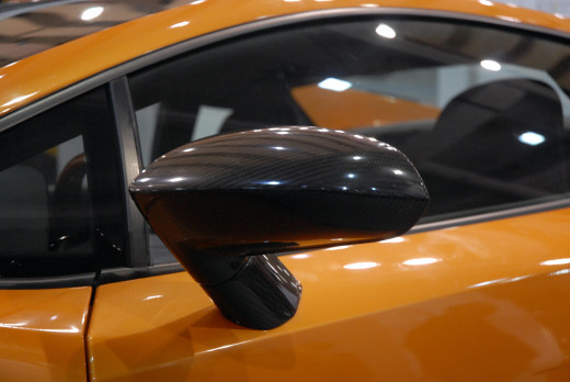 The wing mirror's shape is highlighted by bright lighting from the right. Use lighting to your advantage.