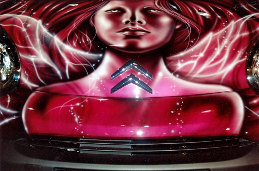 This was art work on the bonnet of the car. The focus of this photo moves totally away from cars.