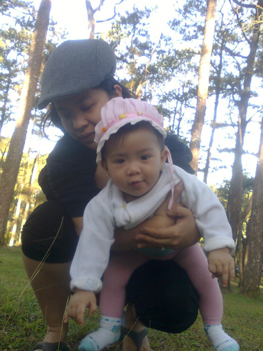 Can't take her hands off the grass.  Wet wipes needed!