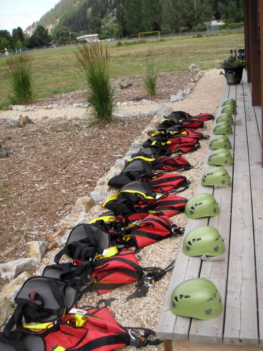 Helmets and harnesses ready for the next group of 10 at Tree Top Flyers, Chase, BC.