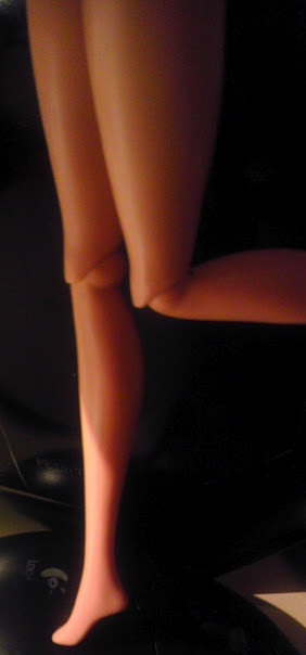 Barbie's knees, post-surgery. A 90-degree bend and a higher arch (also, a spray tan).