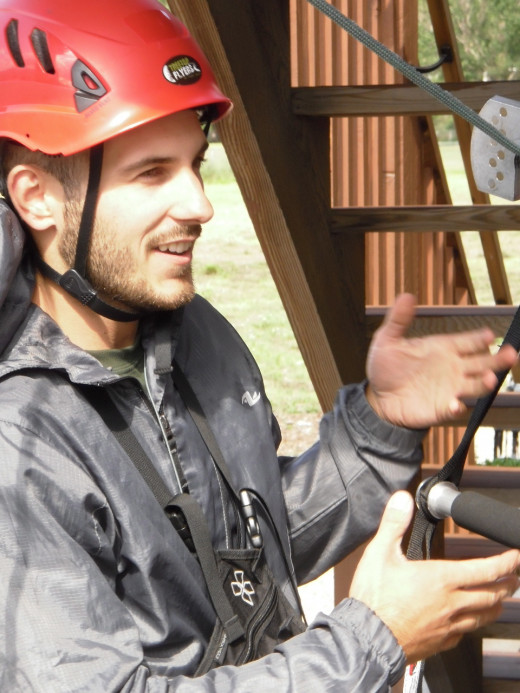 Co-owner Daniel Luzic teaches tourists how to use the safety harnesses and position themselves for safe landing.