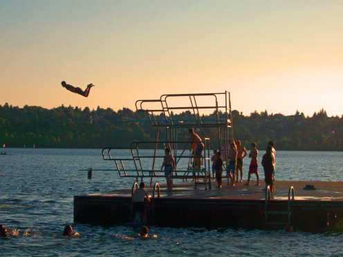 Man diving off high dive at Green Lake