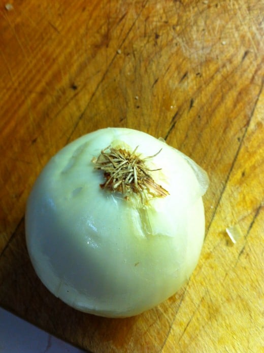 Peel onion leaving the bottom intact.