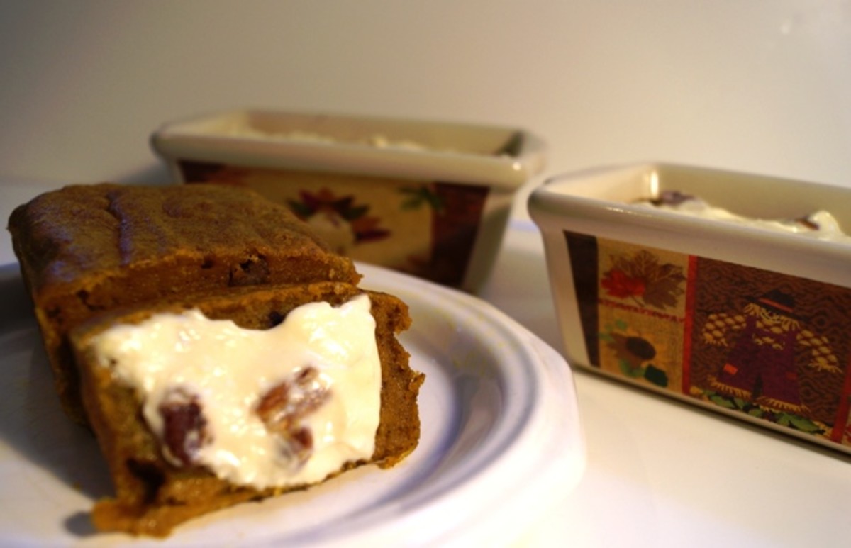 Spiced Pumpkin Bread - a slice with cream cheese topping.