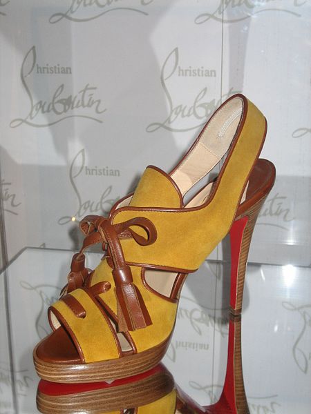 This shoe designed by Christain Louboutin was photographed at the Bata Shoe Museum by Sheila Thompson on February 28, 2006. Once again, notice Louboutin's trademarked red soles.