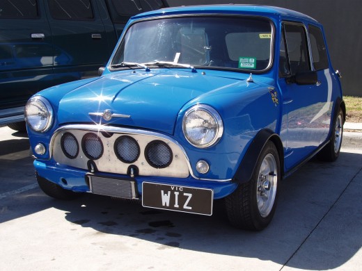 This bright blue Mini Morris is considered a classic car.  International definitions vary, but a classic car is 20 - 40 years old and in optimal condition.