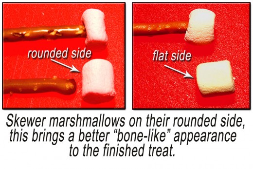 Skewer marshmallows on their round side with the pretzel. Place one marshmallow on each end of each pretzel stick.