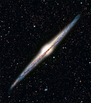 An edge-on spiral galaxy looks like a flattened disk. It contains both old and young stars