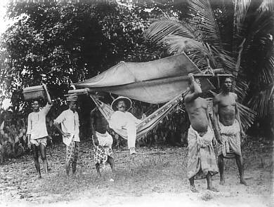 German colonial lord with his slaves around 1885