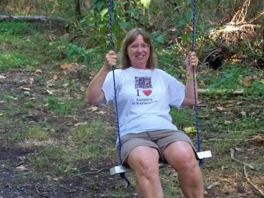 Sandy on a swing in the woods