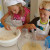 Grace mixes the dry ingredients while Alex handles the wet. Grace mixes the dry ingredients while Alex handles the wet.