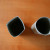 Flatten a cardboard tube in both directions to create a square shape. This step is optional, as the pots may be kept round, if desired. Flatten a cardboard tube in both directions to create a square shape. This step is optional, as the pots may be kept round, if desired.