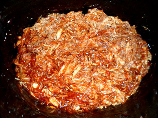 Mix the pork with the barbecue sauce and 1/2 cup of the broth.