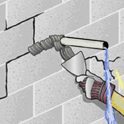 Fig 2. Putting waterproof mortar around a new weep pipe.