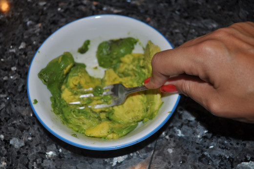 Put the avocado in a bowl and mash it up!