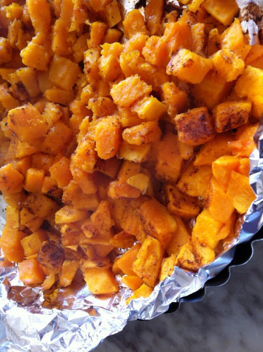Baking fresh, chopped pumpkin with cinnamon and some brown sugar.  Cover it.