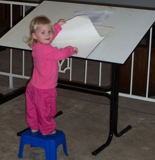 Find new ways to use existing furniture to save money. Mom's drafting table becomes an easel for daughter. 