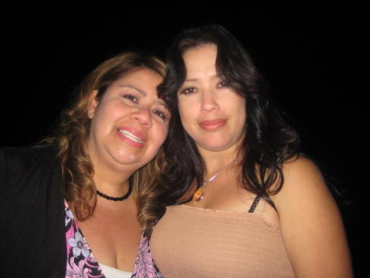 It took me forever to find a pic of me and my sister geez I guess we don't take that many together probably cause we are mad most of the time with eachother!