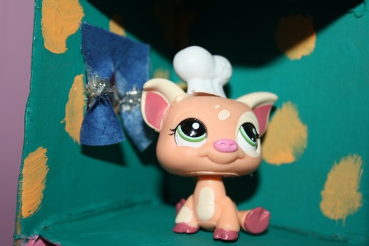Piggy the cook looks happy.