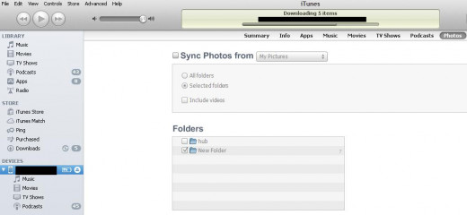 Click the name of your device beneath Devices, then select "Photos" on the right side of the program window.