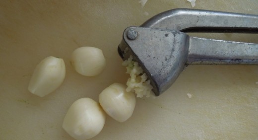 Pressing Garlic with a Garlic Press