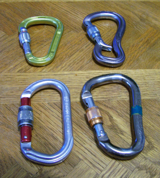 Several styles of locking carabiners. The top right is specially designed to avoid cross-loading.