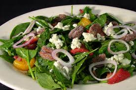 Spinach salad is a very healthy way of eating good and tasty food.