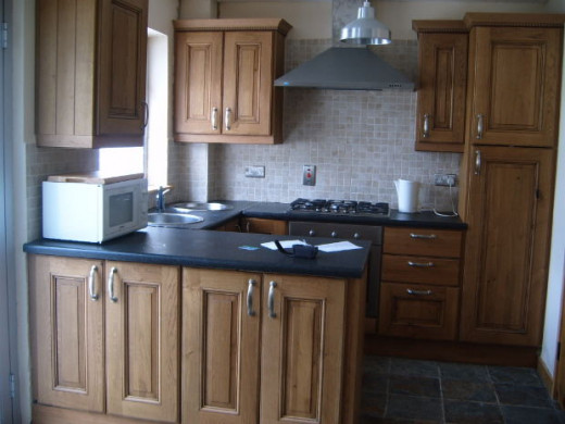 With this bright window and island, this kitchen has good feng shui. All you would need is a mirror behind the stove.